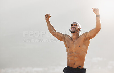 Buy stock photo Shot of a young man celebrating on the beach