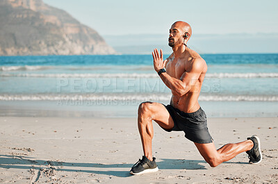 Buy stock photo Shot of a young man doing lunges on the beach