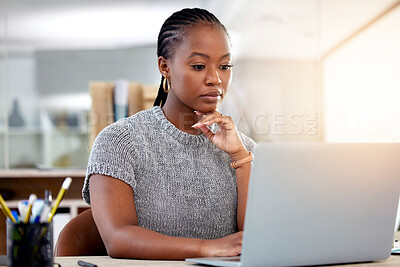 Buy stock photo Laptop, research and a business black woman thinking while working at her desk in her office with flare. Computer, planning and idea with a serious young female employee reading an email at work