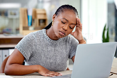 Buy stock photo Stress, headache and sick black woman in office with pain, fatigue or burnout by laptop in creative business startup. Financial crisis, debt and worker with career challenge, fail or designer mistake