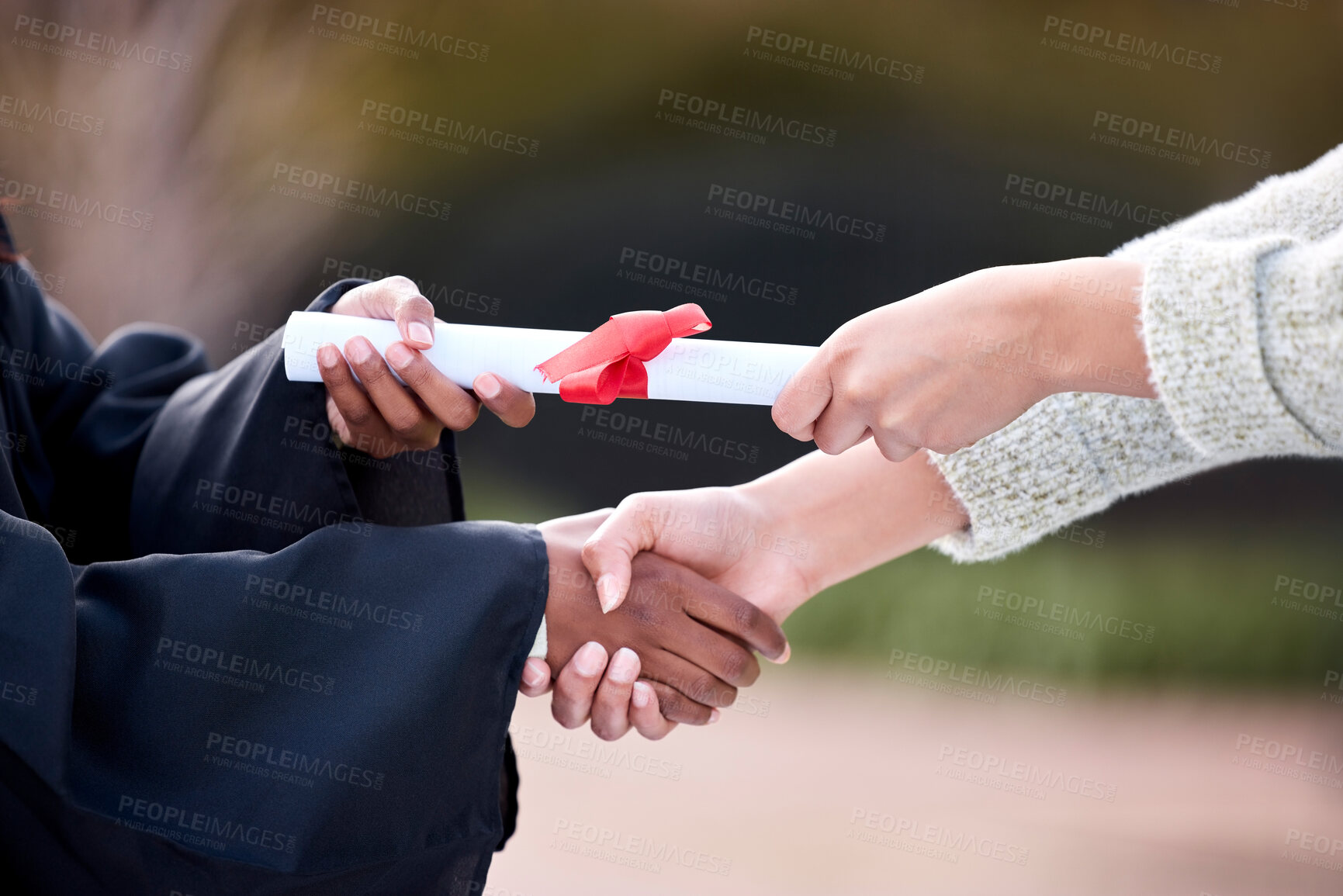 Buy stock photo Handshake, graduation and certificate with congratulations for person at university, education and goals. People, shaking hands and diploma for affirmative action, success and excellence at college