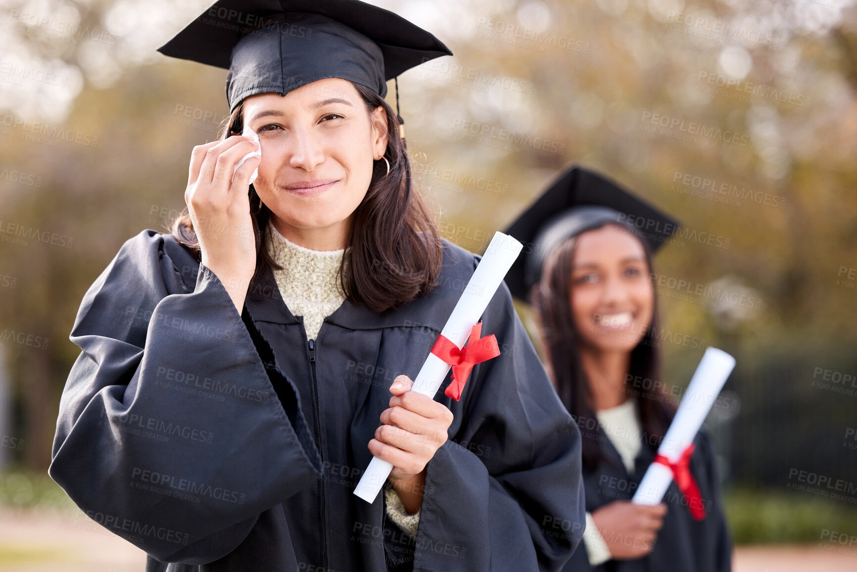 Buy stock photo Woman, graduation portrait and happy crying at college, campus and celebration with diploma. University student, girl graduate and event with tears for success, achievement and goal with certificate