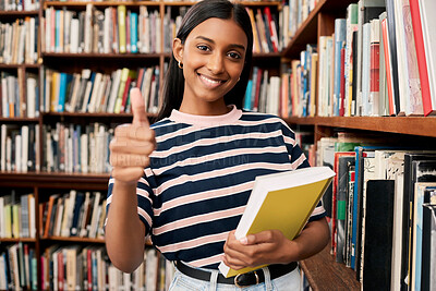 Buy stock photo Portrait, library and student with thumbs up, girl and university with education, knowledge and scholarship. Face, person and woman with books, support and motivation with winner, thank you and smile