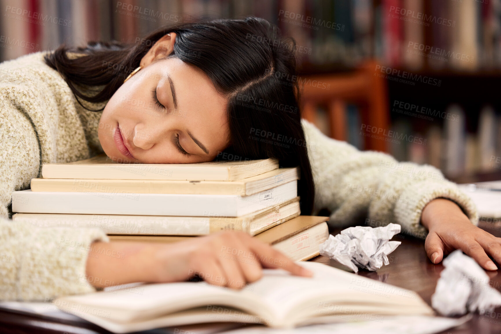 Buy stock photo University, books and woman sleeping at campus library for research, project or homework burnout. College, education and gen z students with fatigue, mental health or nap with notebook for learning