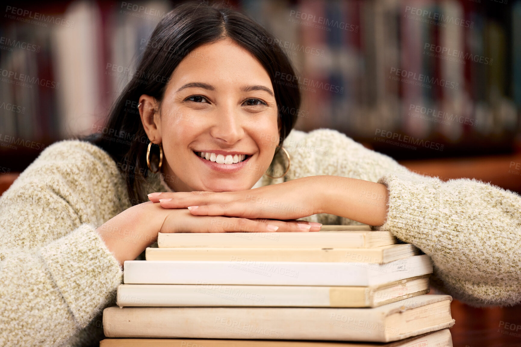 Buy stock photo Portrait, girl and student in library, books and relaxing with smile, education and knowledge with ideas. Face, person and women with literature, scholarship and research for project, joy and college