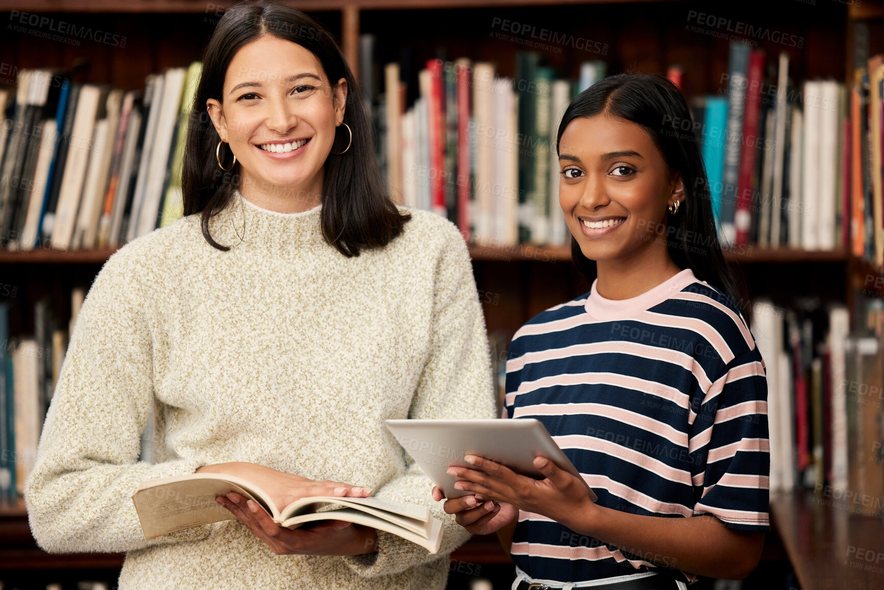 Buy stock photo Portrait, students and team of happy women in library at university with tablet, books and research. Face, smile and diverse girls in college for education, scholarship or friends learning together