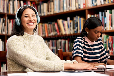 Buy stock photo Portrait, woman and students in library, laptop and research for project, education and knowledge. Face, happy people and girls with books, headphones and excited with studying, learning and internet