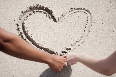 Buy stock photo Interracial couple, hands and drawing heart with sand at beach for love, care or romantic gesture in nature. Top view or closeup of people with shape, emoji or icon of review or lovers by ocean coast