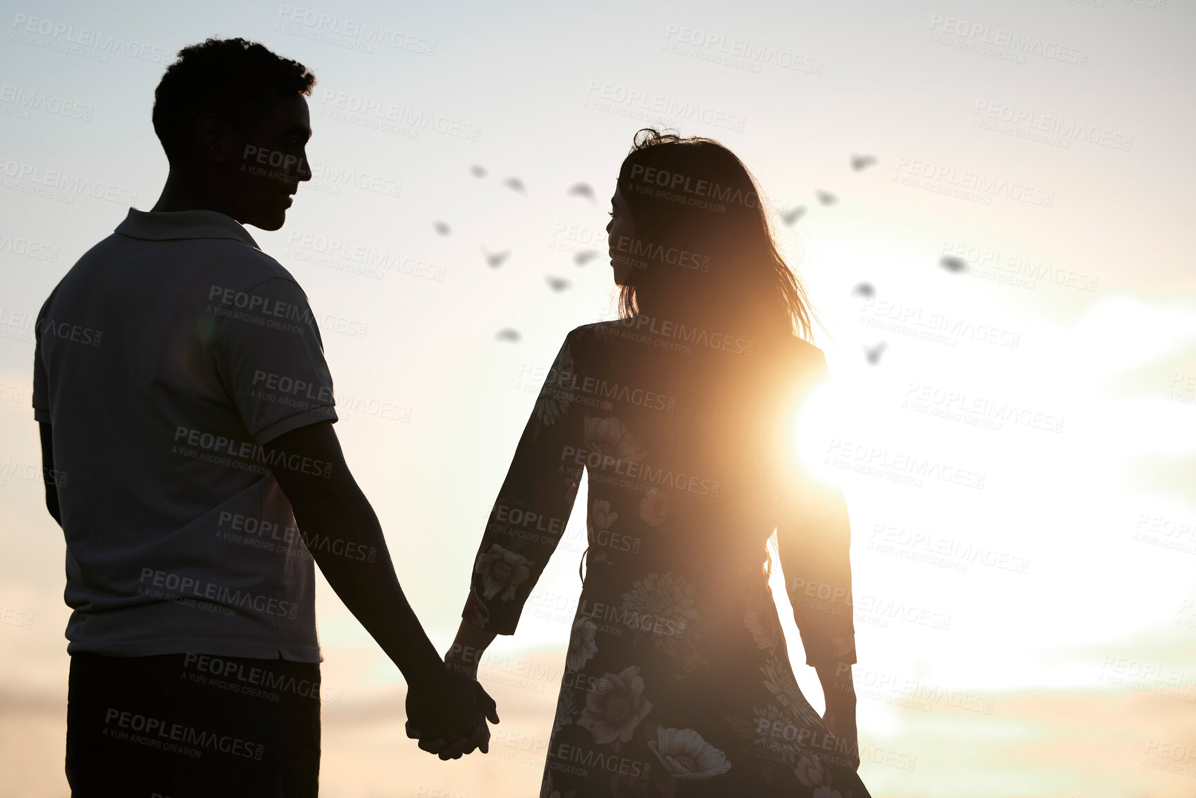 Buy stock photo Couple, silhouette and holding hands at romantic, destination, holiday or honeymoon in summer at sunset on vacation on date. Woman, man and relationship in love or together, memory and travel on trip