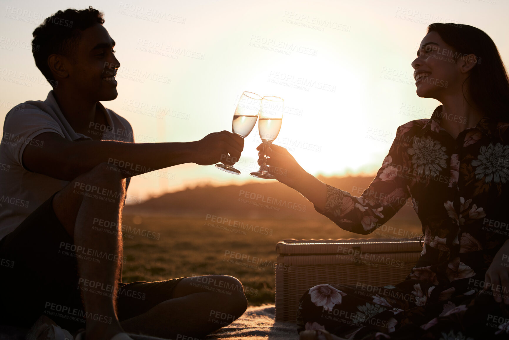 Buy stock photo Wine, sunset or couple toast to celebrate on date in marriage commitment on holiday vacation travel. Cheers, picnic or romantic man bonding with drinks or woman for care, trust or support outdoors