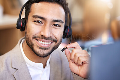 Buy stock photo Shot of a young businessman working in a call center