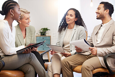 Buy stock photo Shot of a team of business people brainstorming ideas together