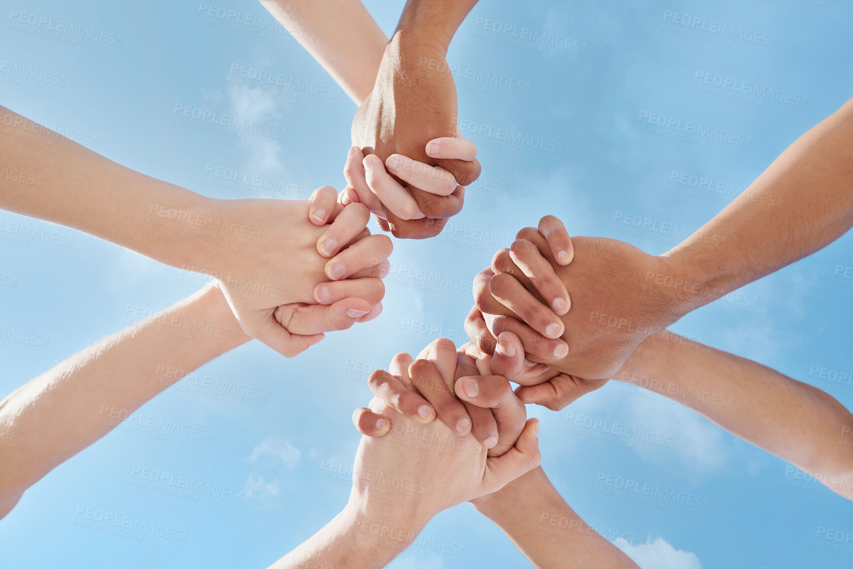 Buy stock photo Below, people and holding hands for support, motivation or education at campus summer. Diversity, friends and collaboration for learning with teamwork, studying or scholarship at college together