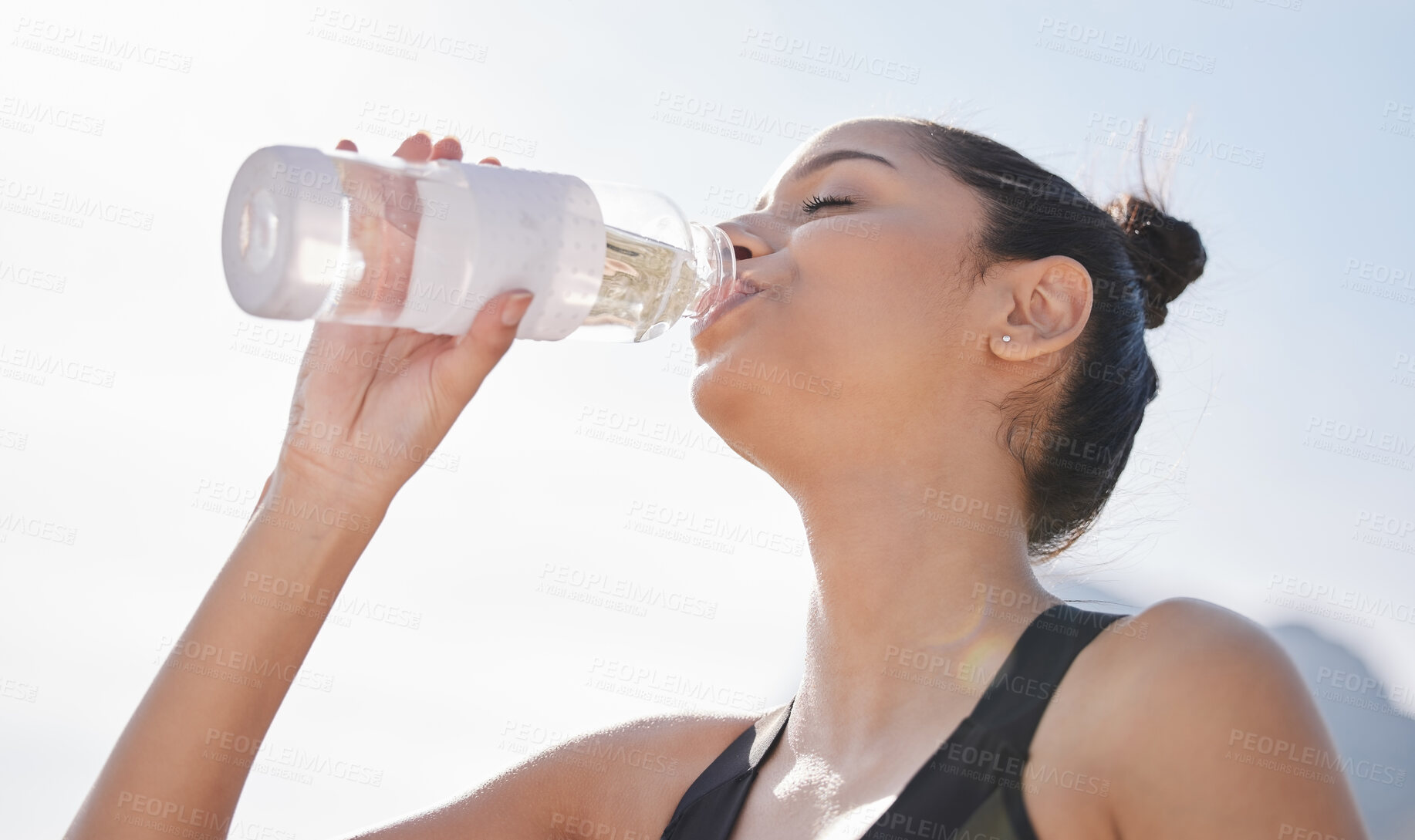 Buy stock photo Outdoor, woman and drinking water for fitness for hydration or detox with exercise, training and workout. Female person, break and thirsty with jogging in Brazil for wellness, self care and health