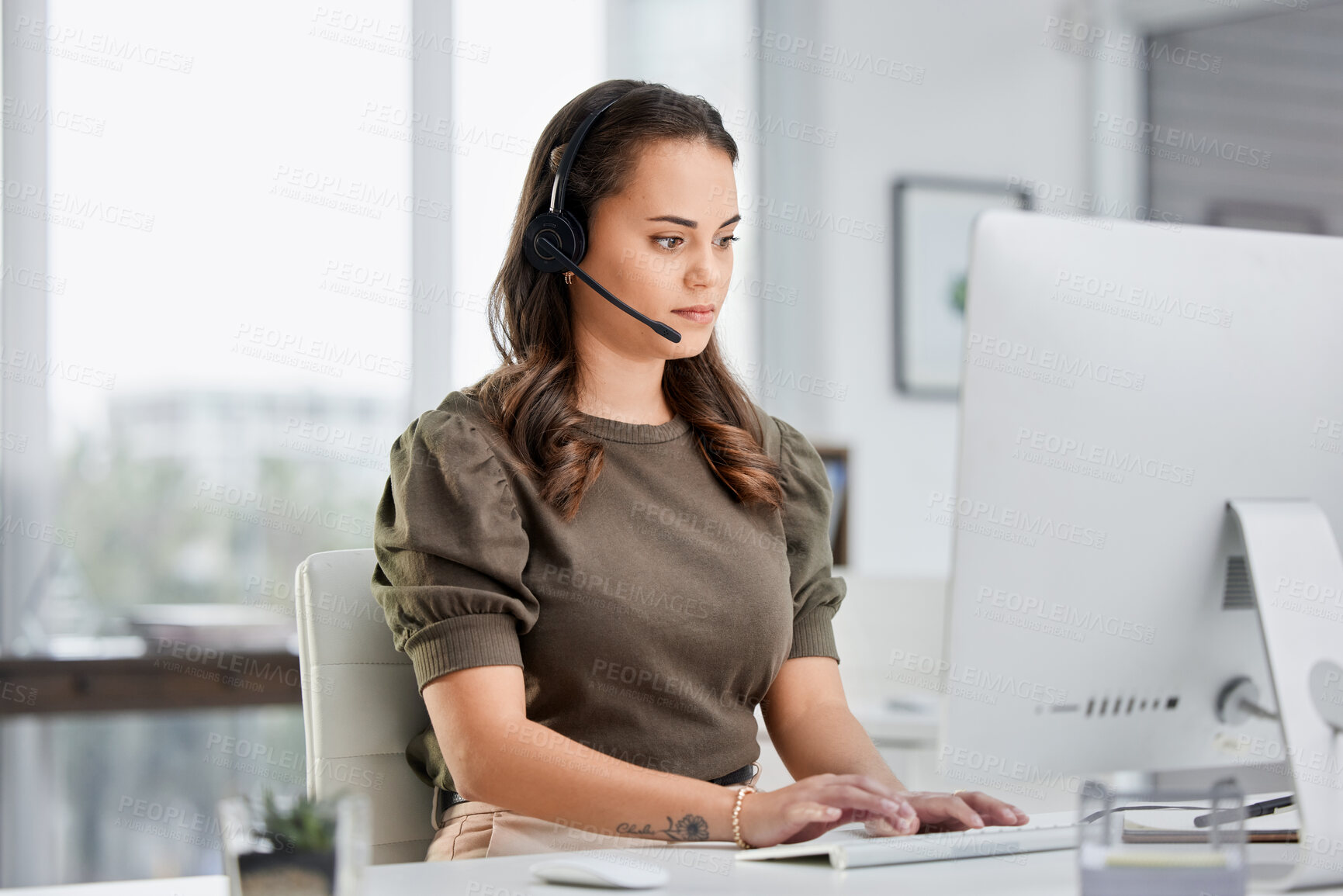 Buy stock photo Virtual assistant, computer or woman typing in call center consulting online at customer services help desk. Research, crm agent or girl consultant in telemarketing or telecom sales company in office