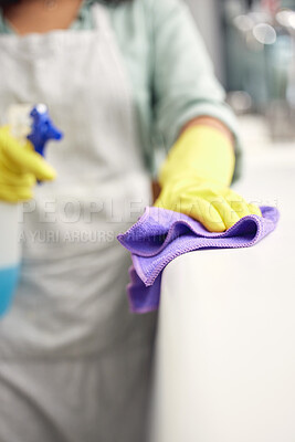 Buy stock photo Housekeeper, cleaning and scrub with gloves or spray in house for furniture, counter and dirt in kitchen. Woman, cloth and apron with detergent or textile in bottle for dust in home for housework