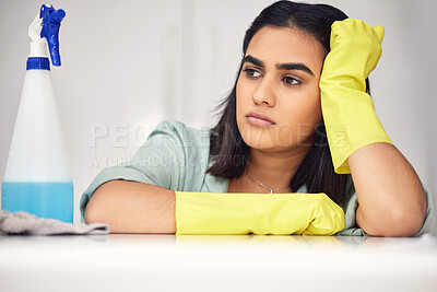 Buy stock photo Woman, bored and spray bottle on counter for cleaning, tired and chemical product or detergent. Female person, burnout and fatigue or exhausted to tidy, maid and cleaning service for maintenance