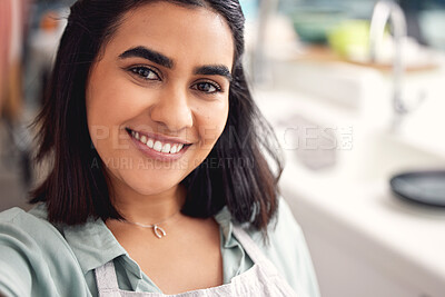 Buy stock photo Selfie, kitchen and woman with smile, portrait and apron for cooking, catering and small business in home. Happiness, service and industry of food, hospitality and chef in apartment and confidence