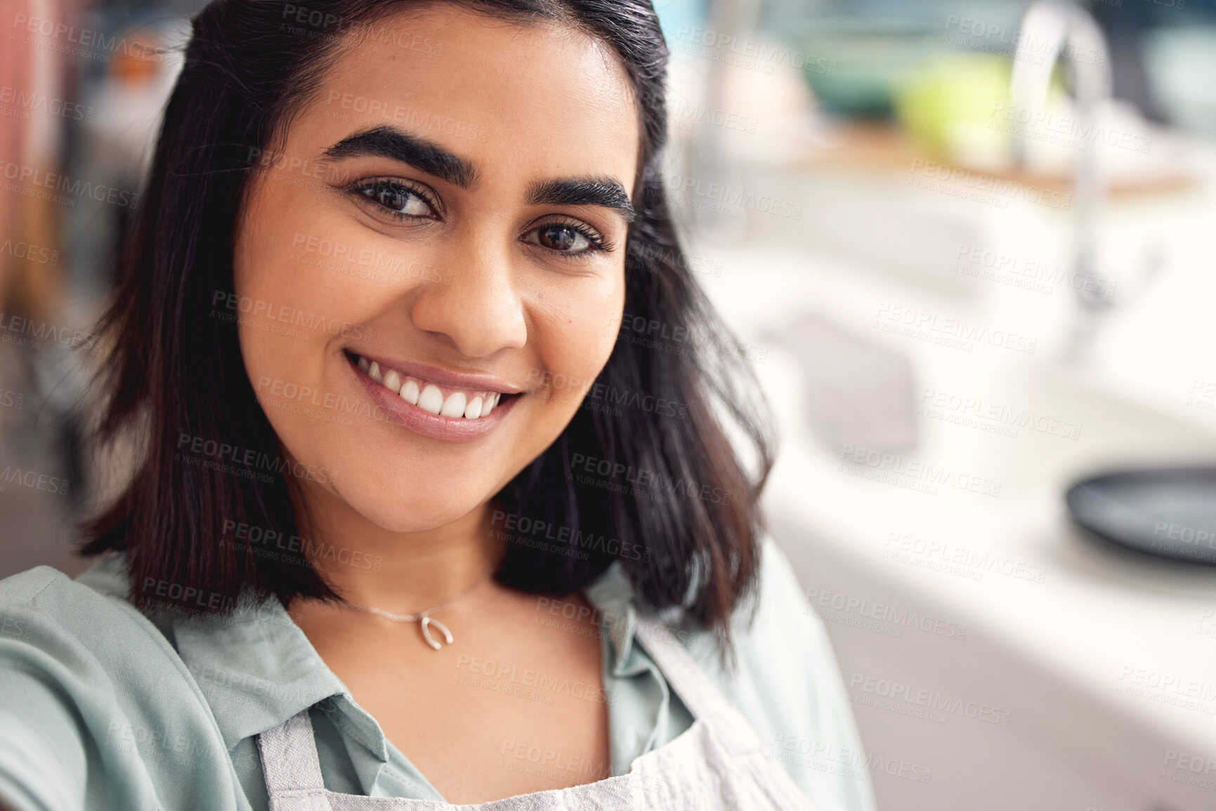 Buy stock photo Selfie, kitchen and woman with smile, portrait and apron for cooking, catering and small business in home. Happiness, service and industry of food, hospitality and chef in apartment and confidence