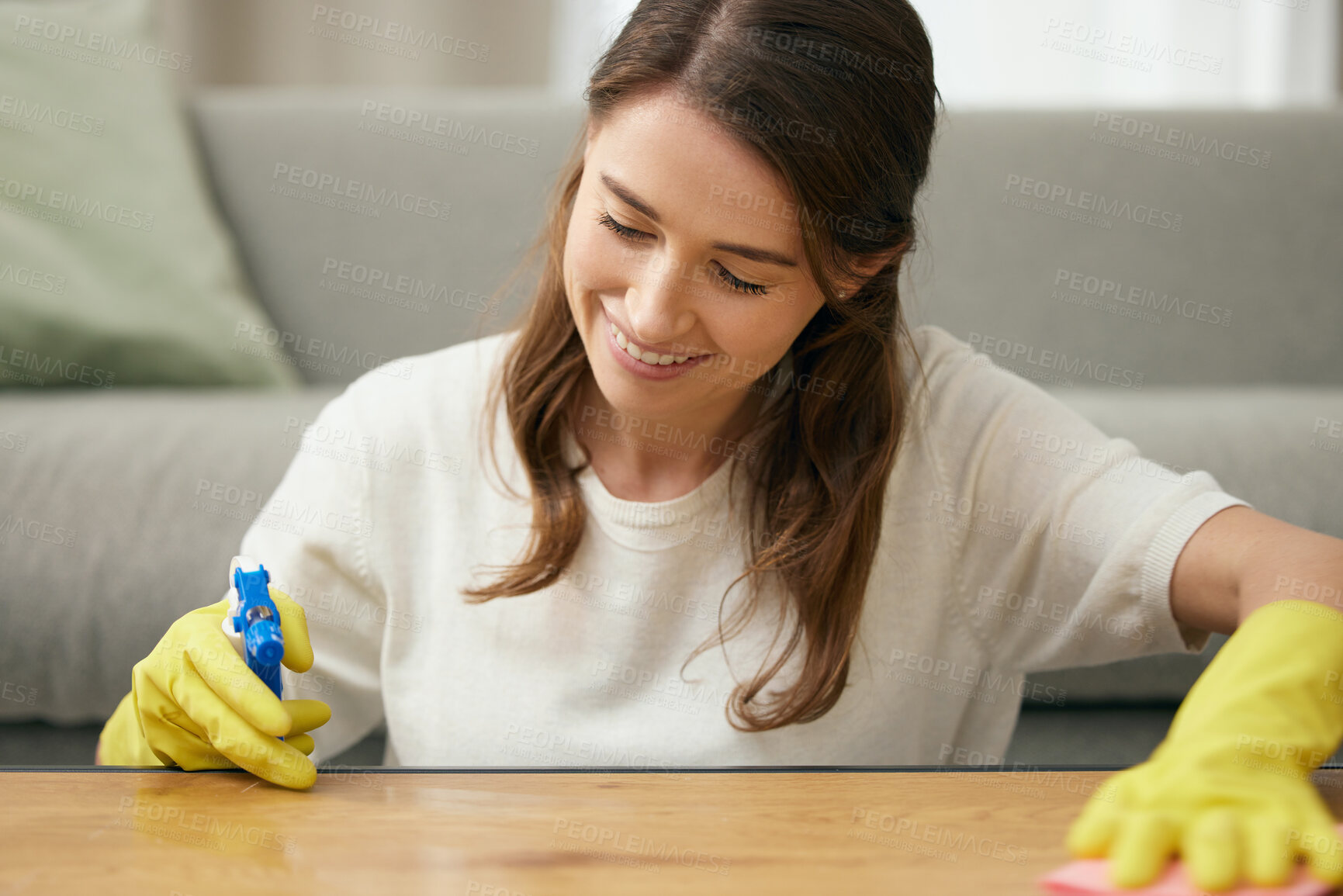 Buy stock photo Woman, cleaning and table in house with smile for housework, spray and cloth for furniture. Female cleaner, or worker with container and soap for washing, hospitality service in home or apartment