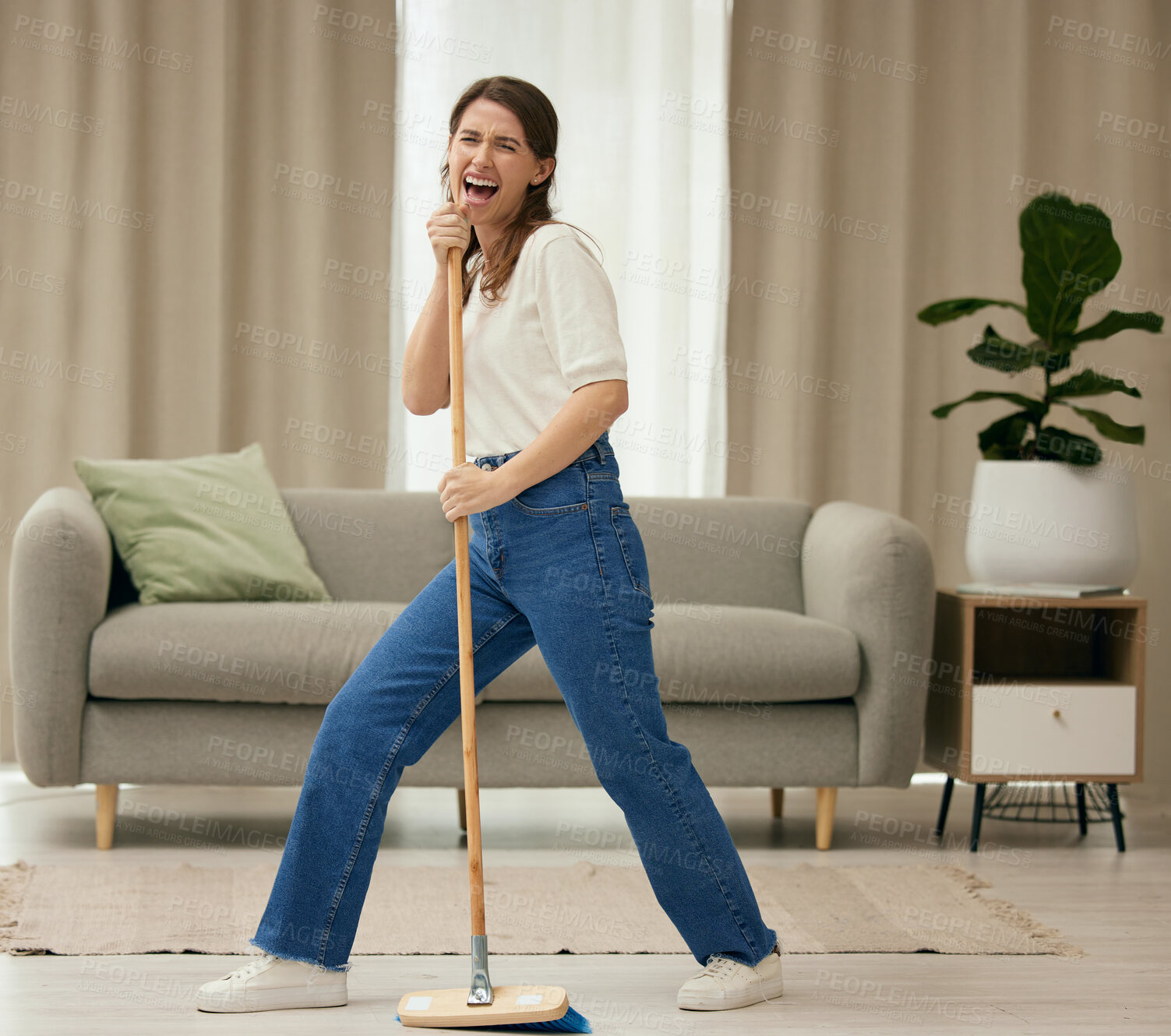 Buy stock photo Woman, singing and broom to clean living room with funny dance, sweeping floor or performance in home. Girl, comic singer and cleaner with spring cleaning, music or working to stop dust, dirt and job