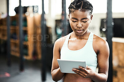 Buy stock photo Gym, healthy and black girl with tablet, workout and videos for fitness, practice and sports online. Club, app and technology for person, internet and wellness with sportswear, training and weekend