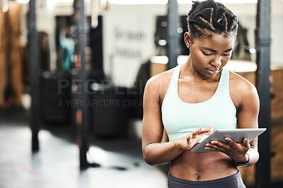 Buy stock photo Black woman, tablet and gym with fitness app for strong body, exercise and online video. African personal trainer, tech and internet in wellness club for client training, streaming workout and typing