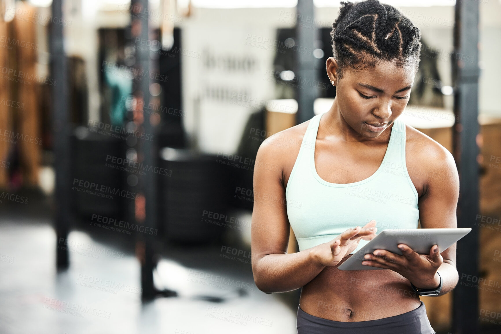 Buy stock photo Black woman, tablet and gym with fitness app for strong body, exercise and online video. African personal trainer, tech and internet in wellness club for client training, streaming workout and typing