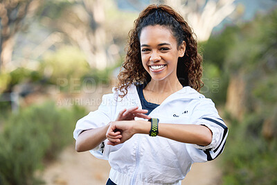 Buy stock photo Woman, portrait and smile with smart watch or heart rate checking or tracking distance, location or progress. Female person, face and forest training or running marathon or workout, time or target