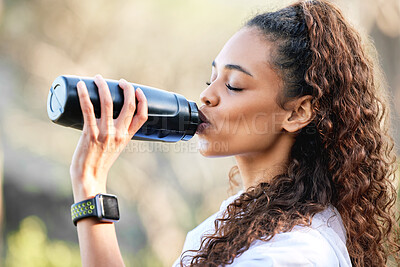 Buy stock photo Woman, hiking and drinking or water bottle in nature for exercise hydration, trekking or workout. Female person, latino and mountain path or running cardio for fitness triathlon, journey or health