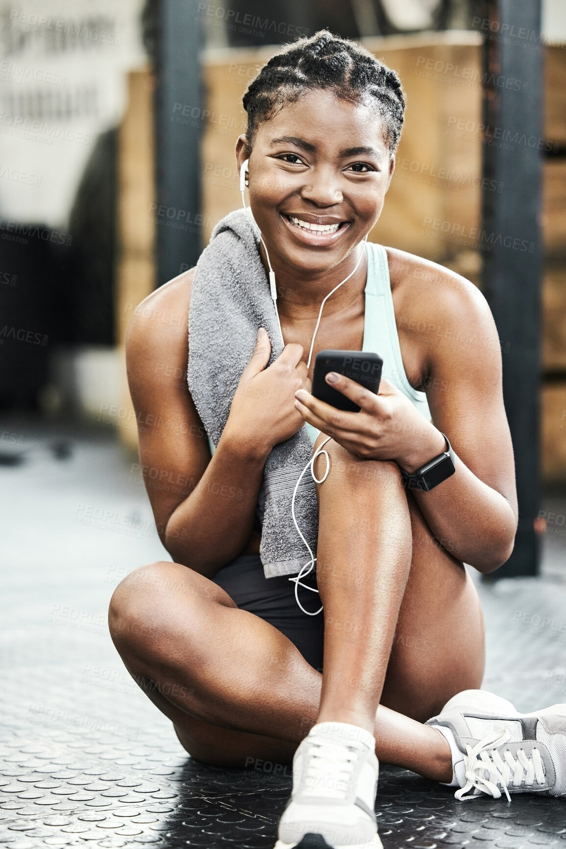 Buy stock photo Fitness, phone for music and portrait of black woman in gym for break from training or workout. Earphones, exercise and smile with happy sports athlete streaming audio in health club for improvement