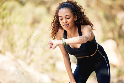 Buy stock photo Woman, exercise and smart watch tracking in nature with fitness app for heart rate, checking or distance. Female person, wrist and monitoring training for progress or weight loss, running or woods