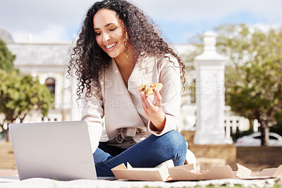 Buy stock photo Shot of an attractive young female university student studying outside on campus during her break