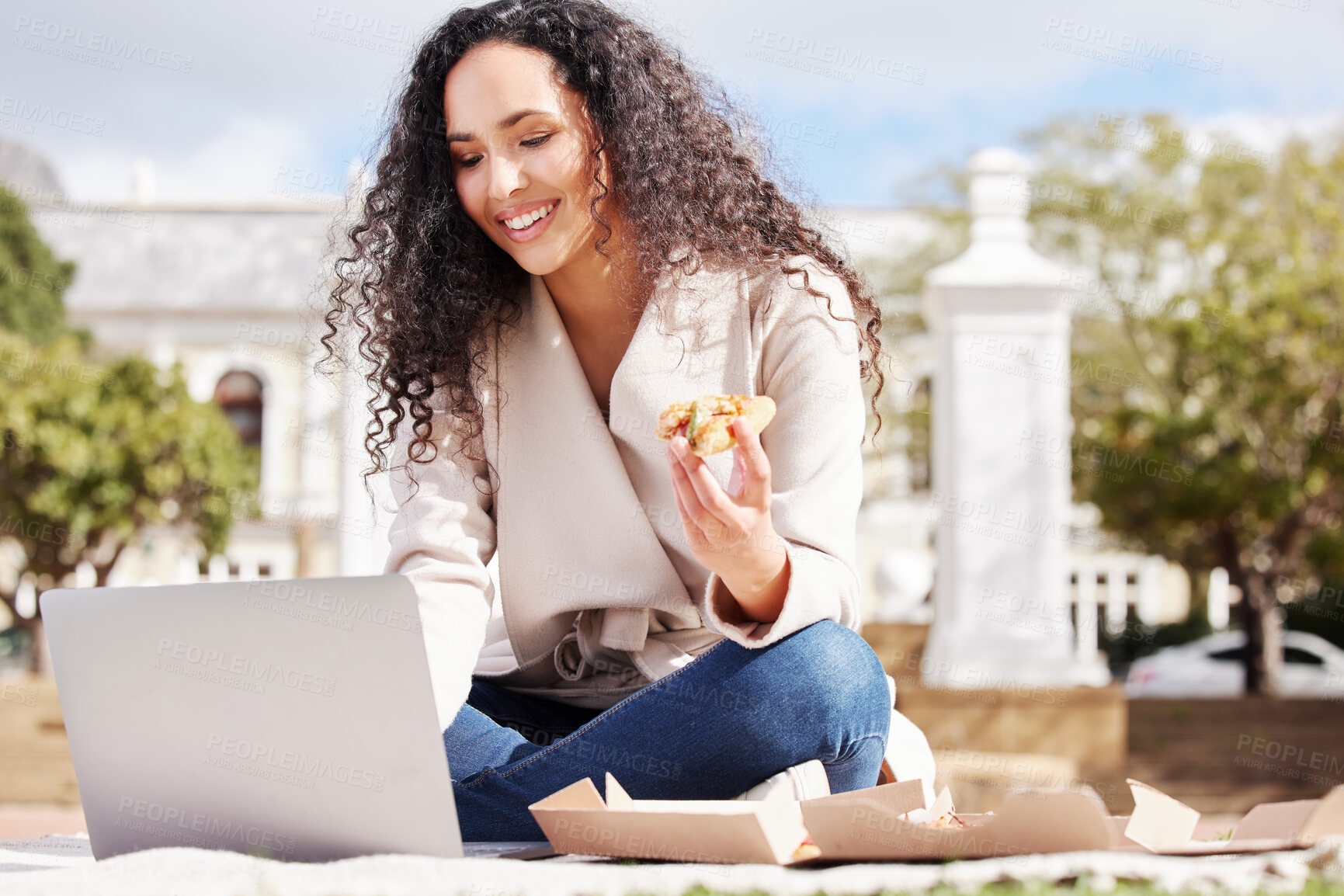 Buy stock photo Shot of an attractive young female university student studying outside on campus during her break