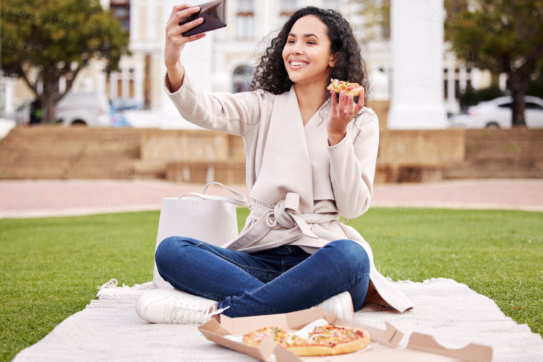 Buy stock photo Shot of an attractive young female university student taking selfies outside on campus during her break