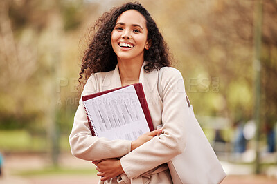 Buy stock photo Portrait of an attractive young female university student standing outside on campus during her break
