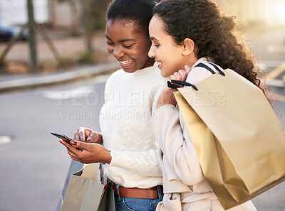 Buy stock photo Smile, women and typing on smartphone for online shopping, sale or retail together outdoor by mall. Happy people, paper bag and cellphone for ecommerce, discount and deal for fashion or clothes