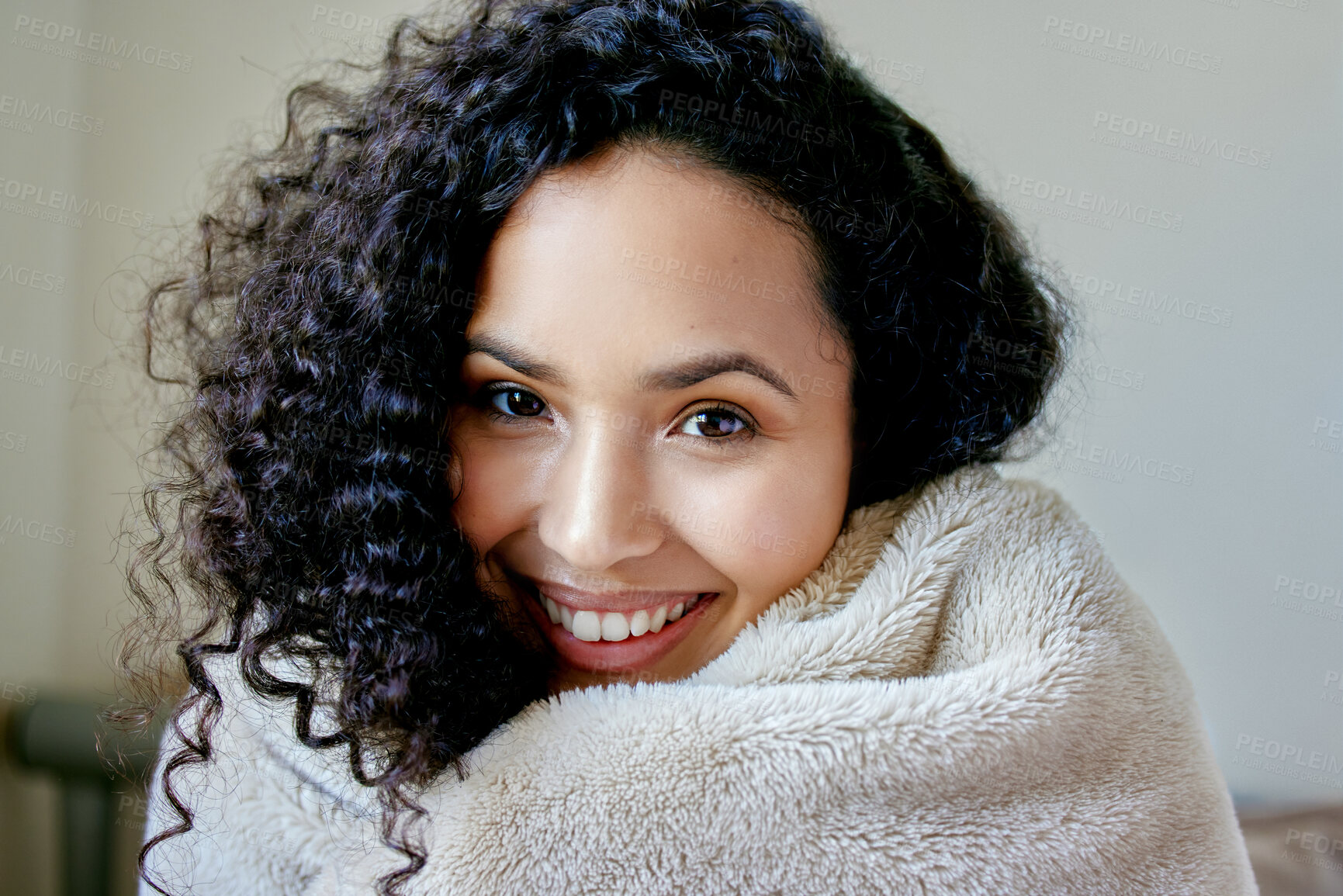Buy stock photo Shof of a young female wrapped in a blanket at home