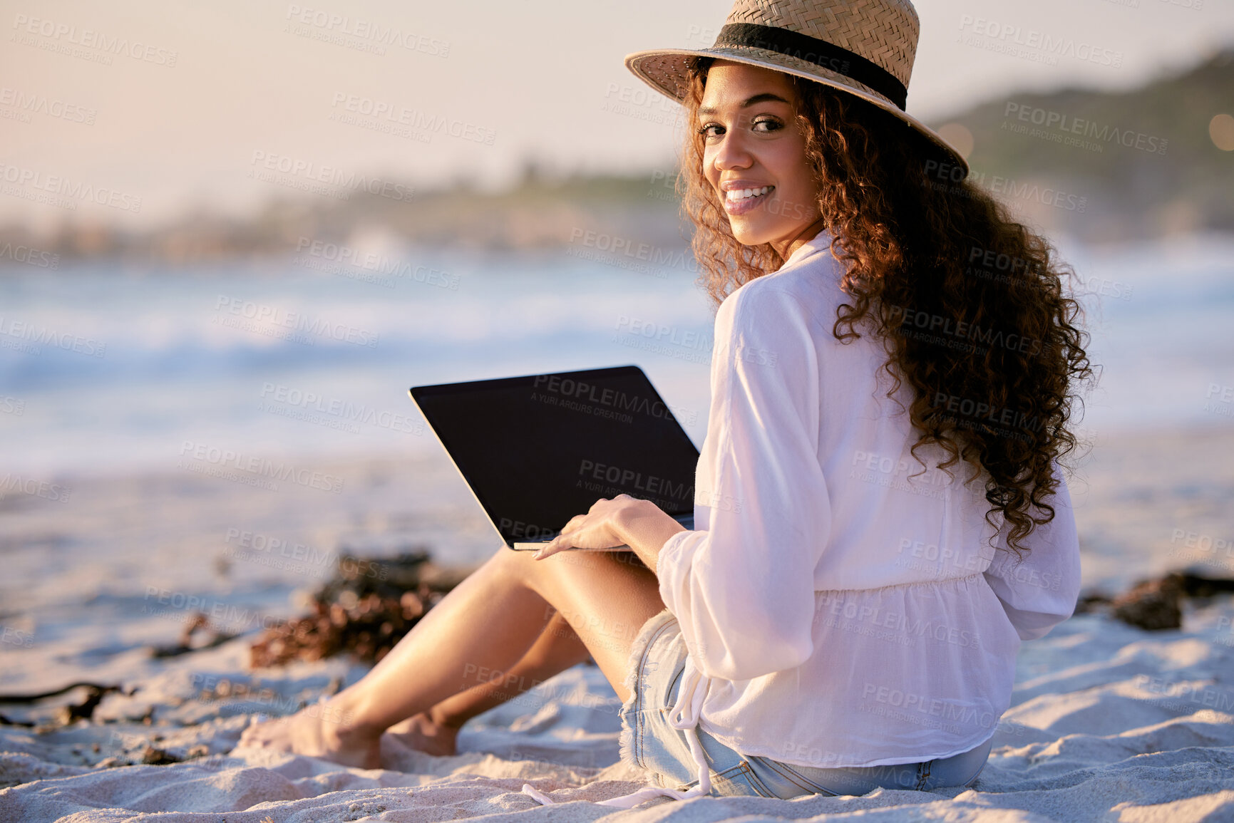 Buy stock photo Portrait, woman and laptop on beach for blog, social media and remote work in nature. Freelance writer, happy and computer outdoors in summer for article, networking and travel journal at sunset