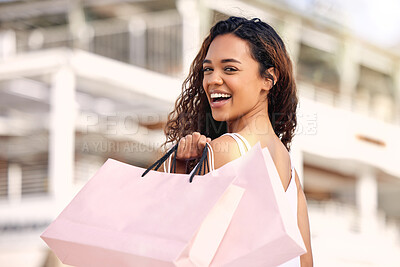 Buy stock photo Shopping bag, city and woman in portrait for fashion, retail and walking with luxury in sale, deal or promotion. Rich, wealth and happy face of african person or customer for urban outdoor and travel