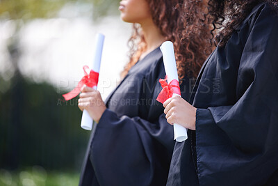 Buy stock photo University, hands and women with certificate at graduation, ceremony or outdoor campus event together. Diploma, pride and students with college achievement for education, opportunity or scholarship