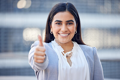 Buy stock photo Shot of an attractive young businesswoman standing alone outside and showing a thumbs up