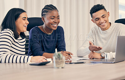 Buy stock photo Shot of a group of business people using a laptop during a meeting