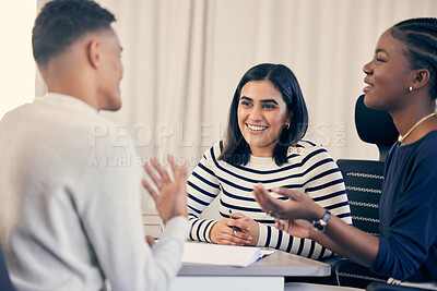 Buy stock photo Shot of a young group of people talking during a meeting at work