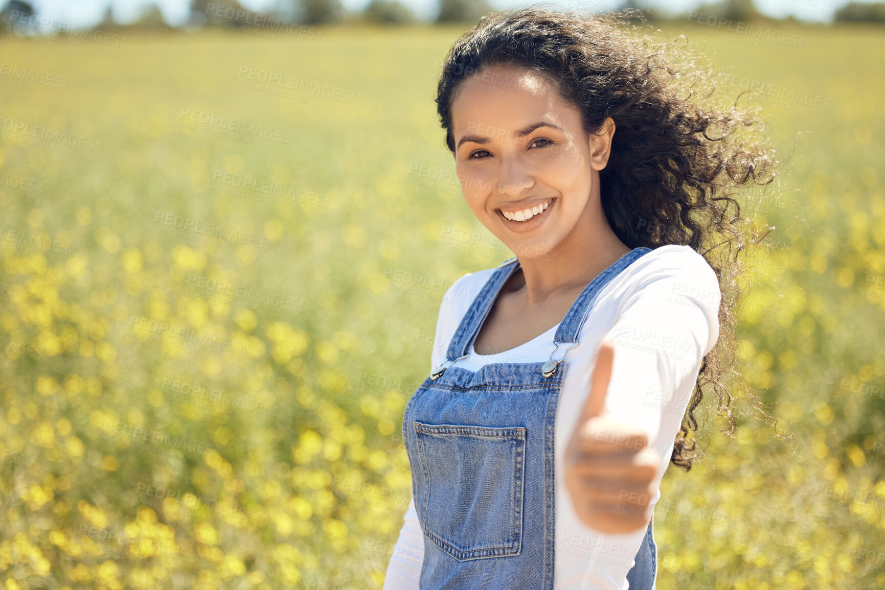 Buy stock photo Portrait, happiness and countryside with woman, thumbs up and support for earth day, sustainability and summer. Face, happy person or girl in field, hand gesture or like with emoji, sign or promotion