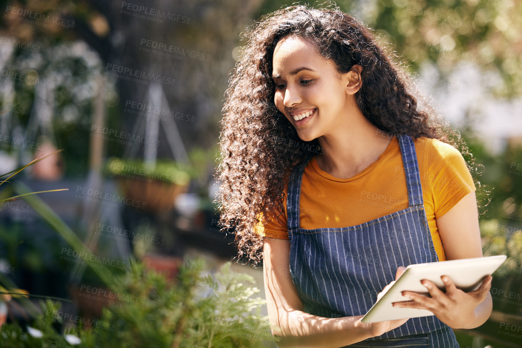 Buy stock photo Happy woman, flowers and inspection with tablet for garden business, service or natural growth in nature. Female person, florist or gardener checking plants on technology for agriculture or ecology