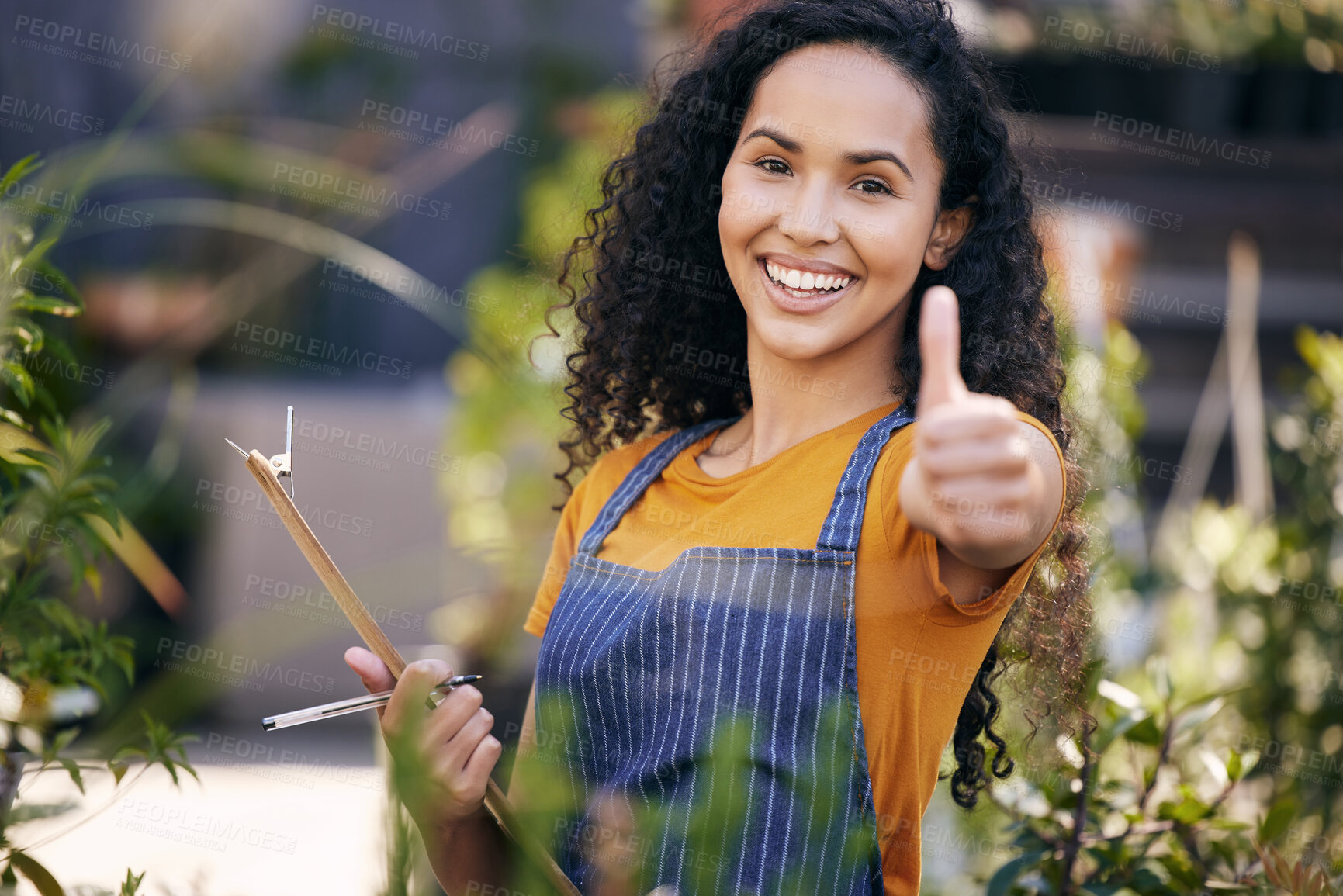 Buy stock photo Thumbs up, florist and portrait of happy woman for success, support or writing notes on checklist for gardening. Greenhouse, sign and person with hand gesture for like, ok and face for review emoji