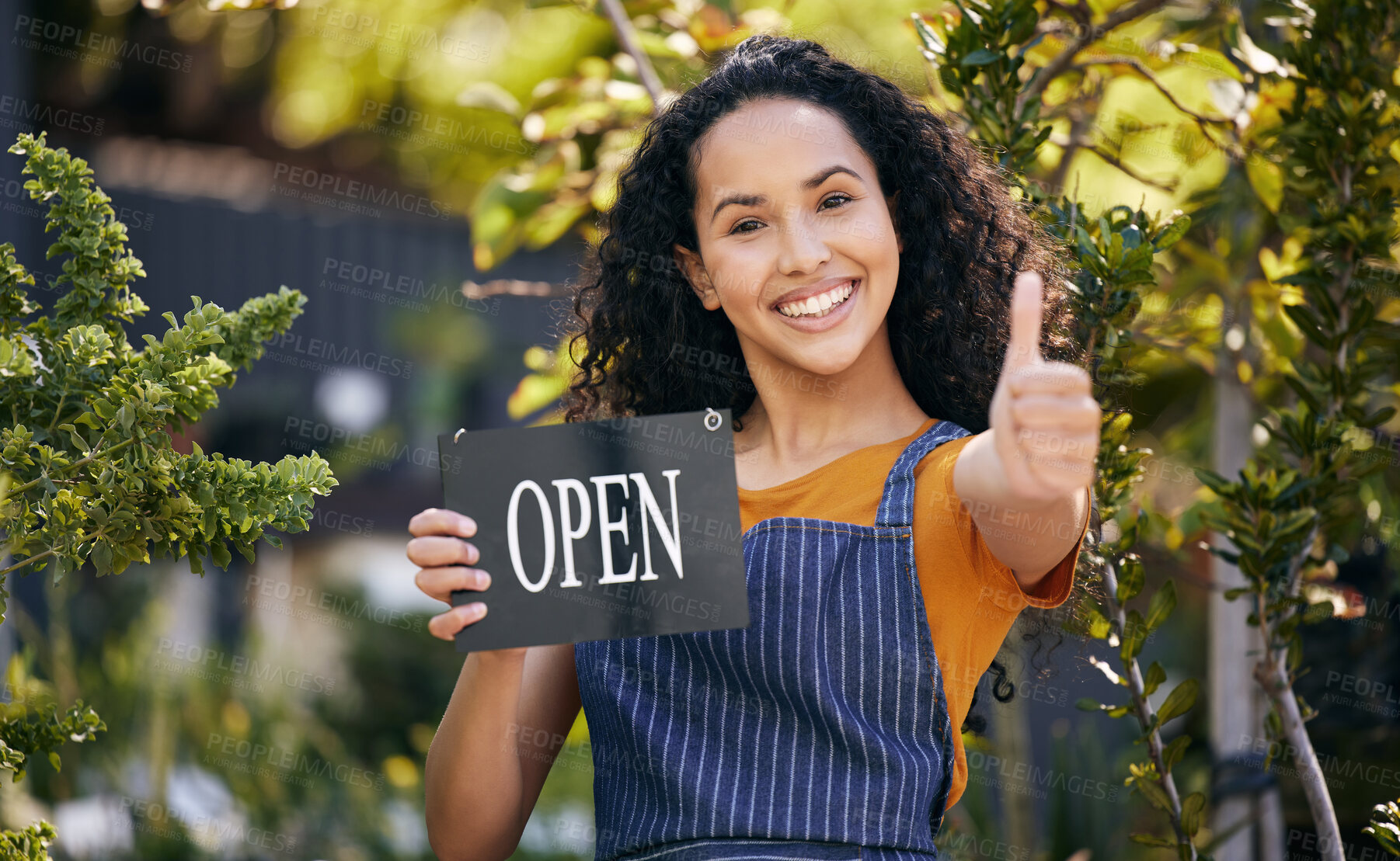 Buy stock photo Thumbs up, garden and portrait of happy woman with open sign for success or support of small business startup. Greenhouse, person or welcome of florist in nature with hand gesture for like, ok or yes