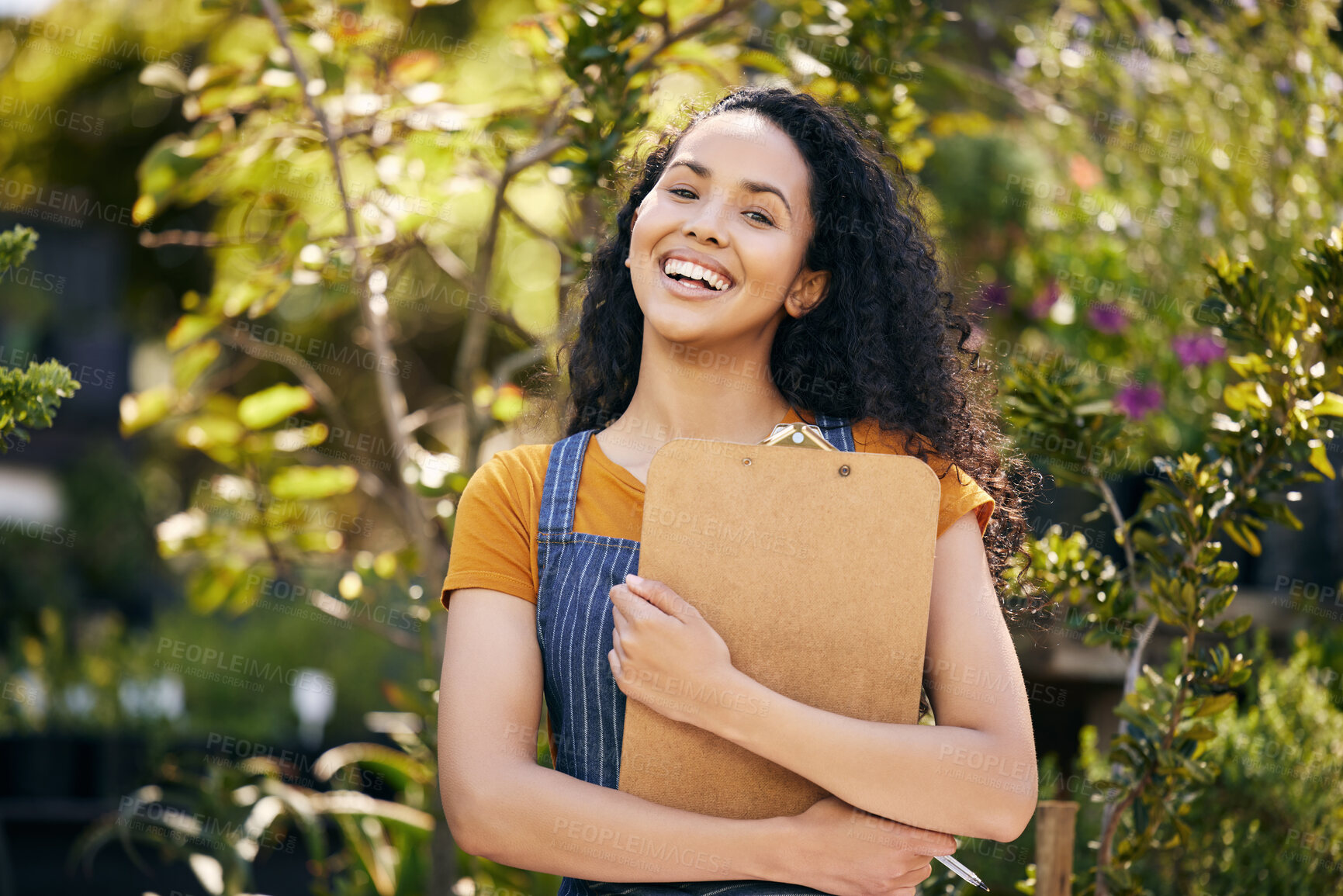 Buy stock photo Outdoor, flower seller and smile for portrait, woman and entrepreneur with apron, spring and growth of plants. Small business, nature and person in garden, ecology and green in shop and florist