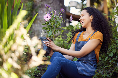 Buy stock photo Outdoor, florist and nature for flowers, woman and entrepreneur with apron, spring and growth of plants. Small business, happy and person in garden, ecology and service for shop, green and smile